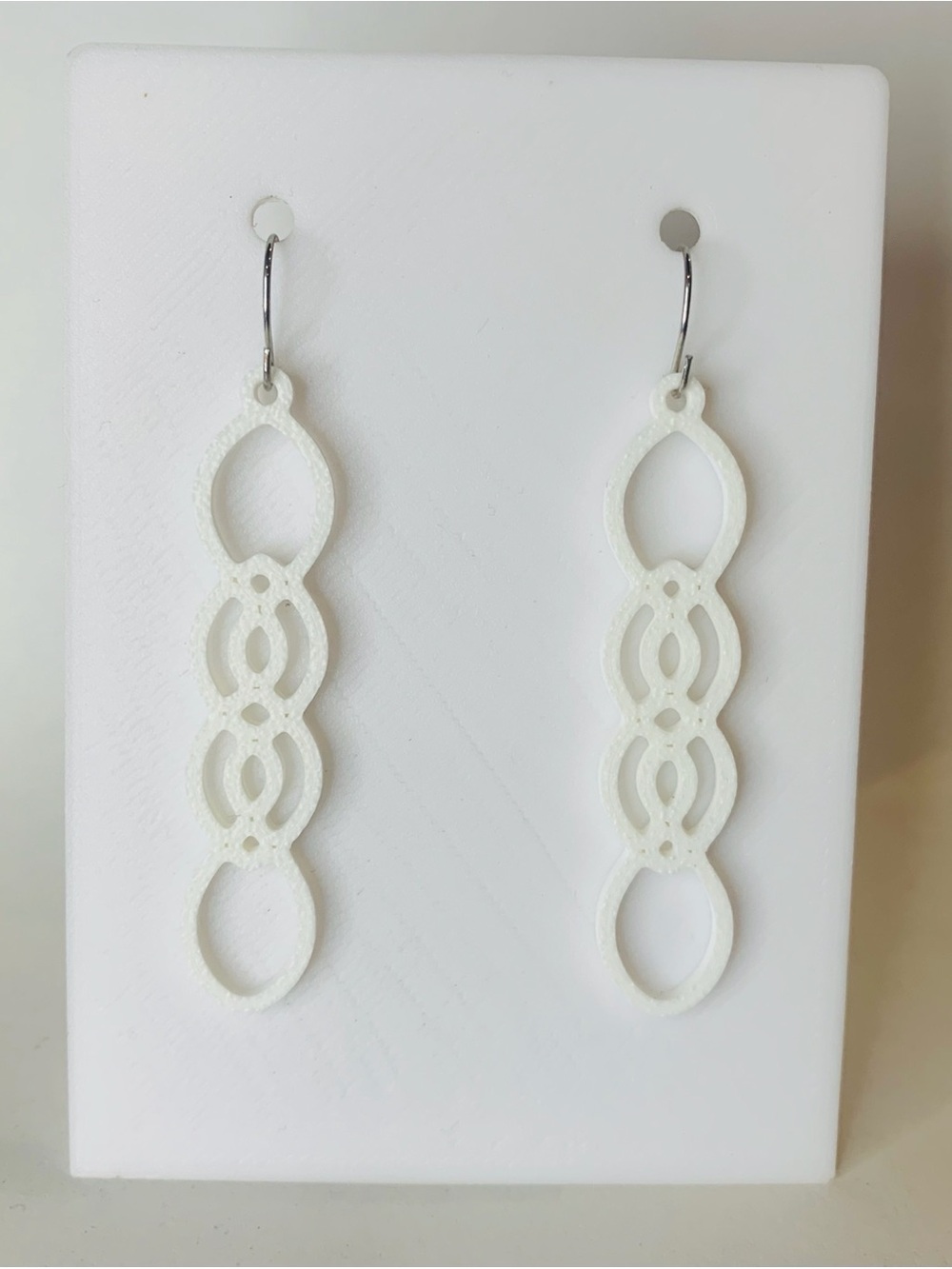 White Interlocking Loop Dangle Earrings
